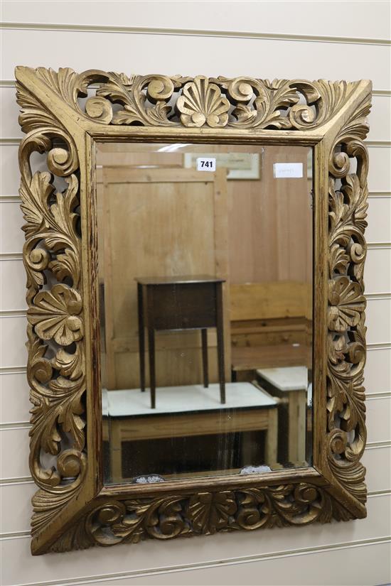 A modern Florentine style carved gilt pine wall mirror W.65cm